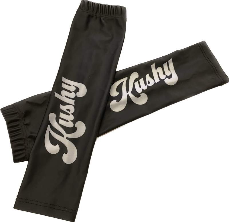 Kushy Arm Sleeves - 2 Pack: Set of two sleek, black arm sleeves featuring the Kushy logo, designed for comfort and style.