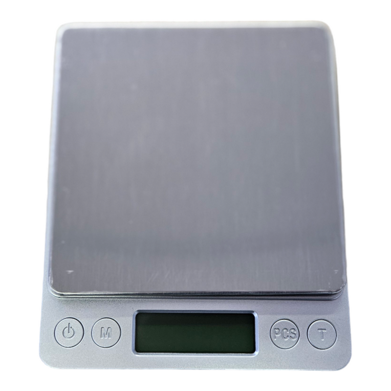 Digital scale with a capacity of 500 grams and precision of 0.05 grams for accurate measurements.